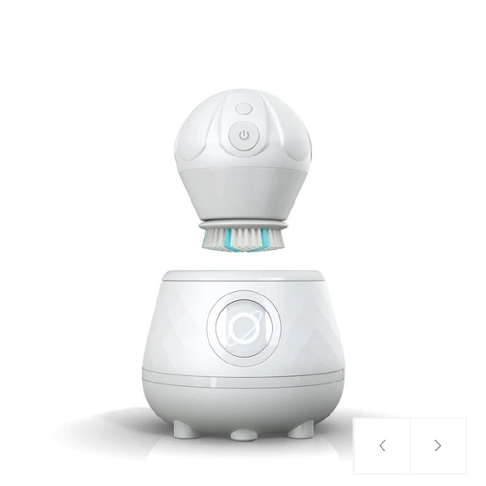 NWT TAO clean facial brush with UV charging system